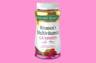a bottle of vitamins on a pink background