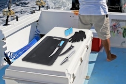 Mossy Oak Fish Fillet Knife Set being used on boat
