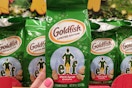hand holding elf goldfish