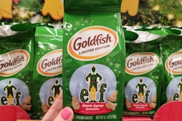 hand holding elf goldfish