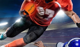 a person carrying a light-up football 