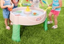 kids surrounding a Little Tikes water table
