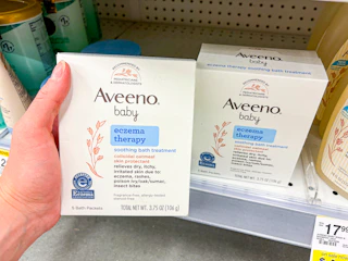 hand holding aveeno bath treatment in walgreens