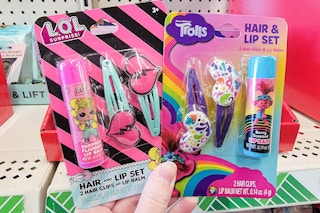 hair clip and lip balm sets featuring trolls and lol surprise