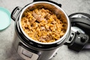 an instant pot duo plus pressure cooker with food in it