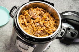 an instant pot duo plus pressure cooker with food in it
