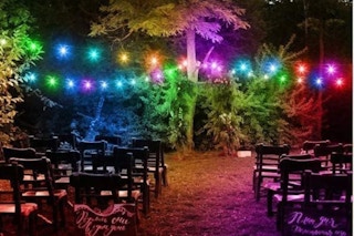 string lights above a collection of chairs