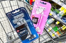 2 packs of disposable razors in a cart