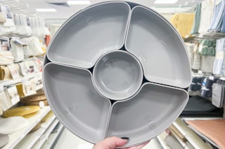Room Essentials Server Plate held up in center isle at Target