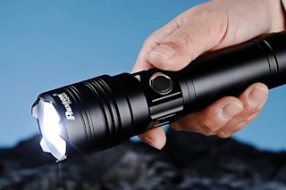 a man holding a flashlight