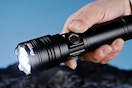 a man holding a flashlight