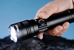 a man holding a flashlight