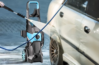 Lifestyle image of Tebru water pressure cleaner being used to clean a car
