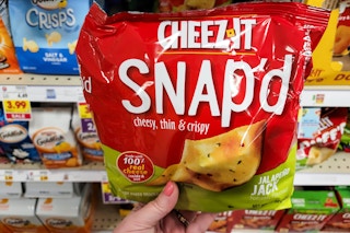hand holding a bag of cheez it snap'dcracker chips at kroger