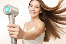 a woman holding an ionic hair dryer