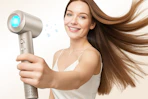 a woman holding an ionic hair dryer