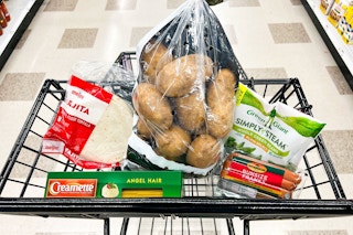 meijer tortillas, potatoes, green giant veggies, creamette pasta, eckrich franks in a black shopping cart