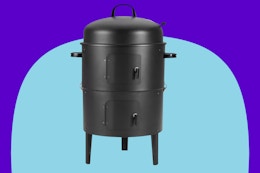  Amazon Basics 16 inch Vertical Charcoal Outdoor Smoker on a blue background.