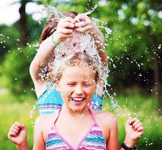 water balloon bursting on a kids head