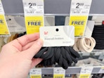 hand holding walgreens ponytail holders