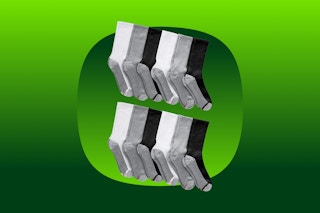 black white and gray socks on a green background