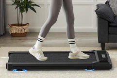 a woman walking on a walking pad
