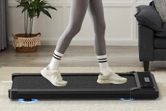 a woman walking on a walking pad