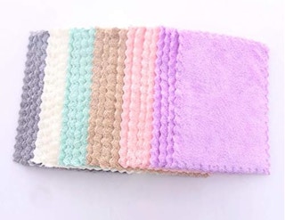 a stack of colorful dishcloths