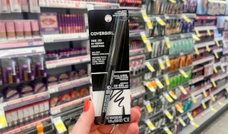hand holding a covergirl Ink It perfect point plus gel eyeliner pencil
