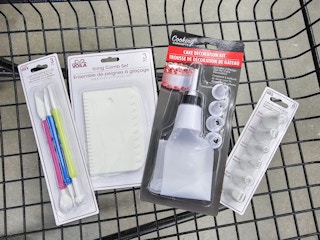 cake decorating supplies in a cart