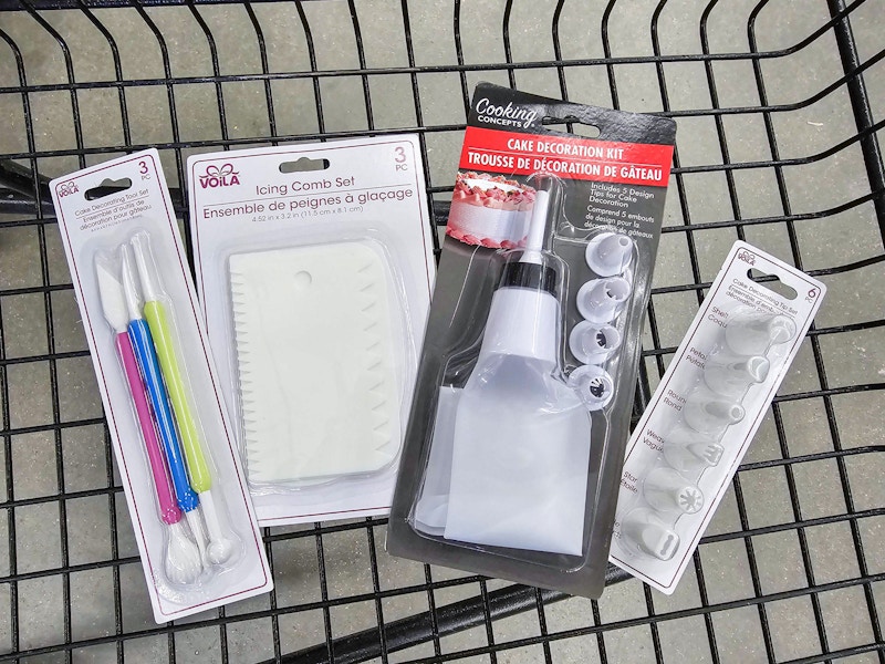 cake decorating supplies in a cart