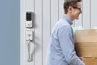 a man walking past a keyless smart lock