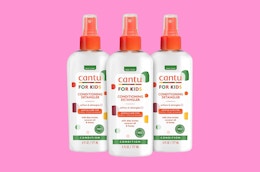 three spray bottles of hair detangler 