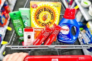 garnier shampoo, sally hansen hard as nails, colgate toothpaste, honey bunches of oats cereal, and persil detergent in a cart