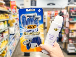 hand holding dove bic items for haul 