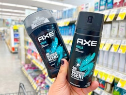 hand holding axe apollo stick and spray deodorant