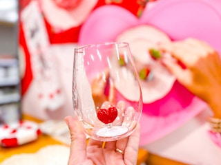 In store photo taken at Target for the Threshold Valentine's Day heart wine tumbler (hand holding it up)