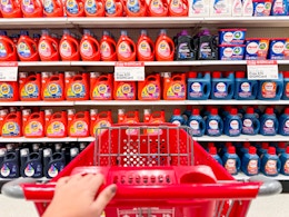 target cart parked in front of detergent sitting on a target shelf