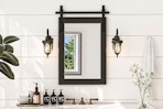 Lifestyle image of a farmhouse style accent mirror in bathroom setting