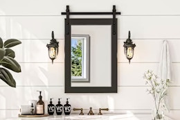 Lifestyle image of a farmhouse style accent mirror in bathroom setting