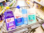 walgreens toilet cleaner, multipurpose cleaner, disinfecting wipes and spray in a cart