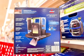 bissel little green max pet carpet cleaner sitting on a target cart