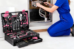 a woman using a repair kit