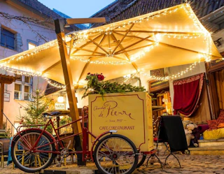a food cart outside with string lights