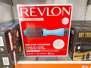 A Revlon One-Step Hot Air Brush in its box on a shelf.