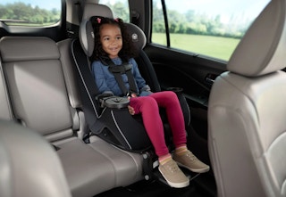 child sitting in a Safety 1st car seat in the back seat of a vehicle