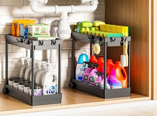 two organizers under a sink with cleaning supplies