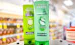 two bottles of garnier fructis shampoo and conditioner