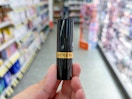 hand holding revlon lipstick in walgreens