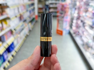 hand holding revlon lipstick in walgreens